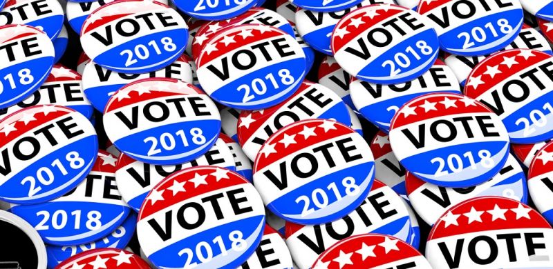 Vote Pin Background - Pile of Red White and Blue Political Campaign Buttons